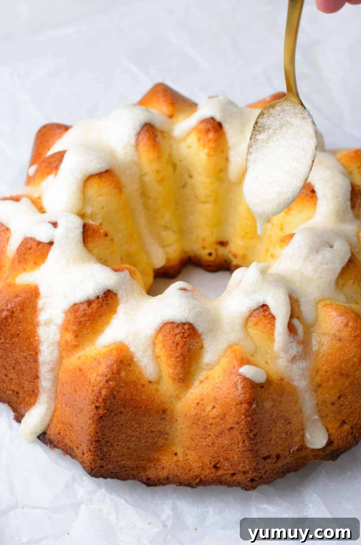 drizzling brown butter glaze on brown butter bundt cake