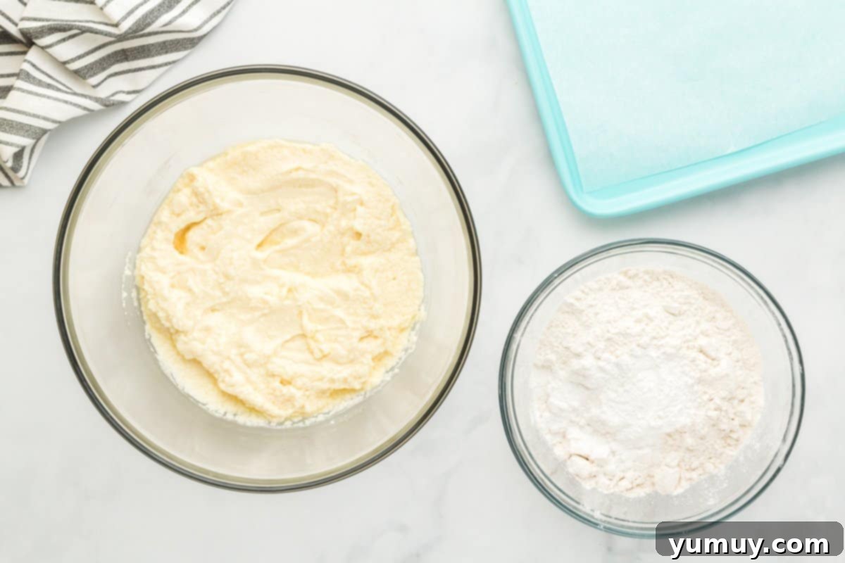 Fathers Day Cookie Creations 12 Glass bowls containing wet and dry ingredients for Father's Day cookies, ready for mixing.