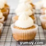 A tray of twelve beautifully frosted chai cupcakes, ready for serving.
