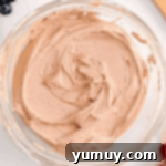 Luscious Chocolate Fruit Delight 7 The finished creamy chocolate dip rests invitingly in a glass bowl, ready to be served.