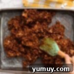 Chocolate Crackle Squares 10 Spreading chocolate Rice Krispies mixture evenly into a baking pan lined with wax paper.