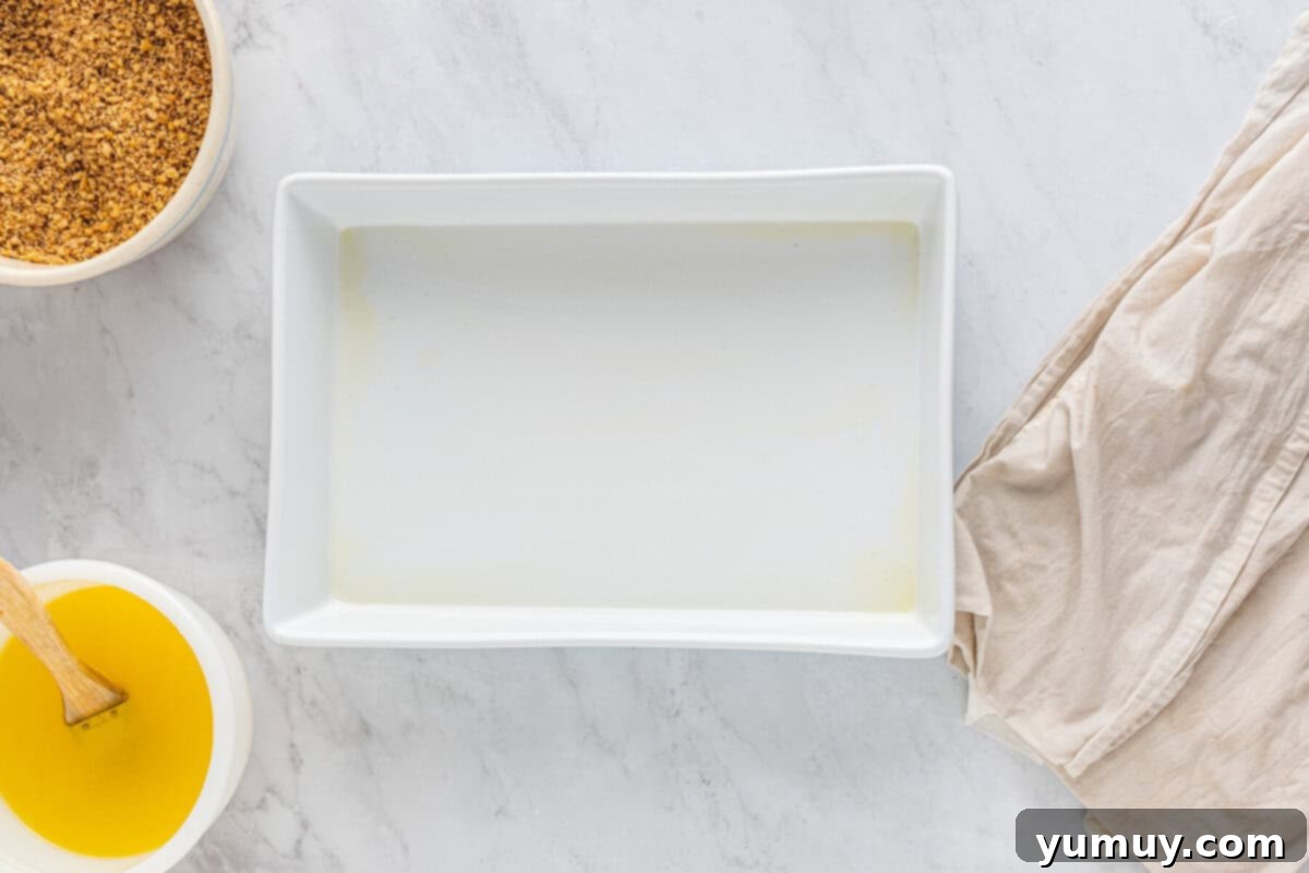 Sweet & Crispy Homemade Greek Baklava 14 A baking pan meticulously lined and greased with melted butter, ready for the phyllo dough.