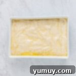 Sweet & Crispy Homemade Greek Baklava 8 Unbaked baklava with its many layers visible in the baking pan, ready for scoring.