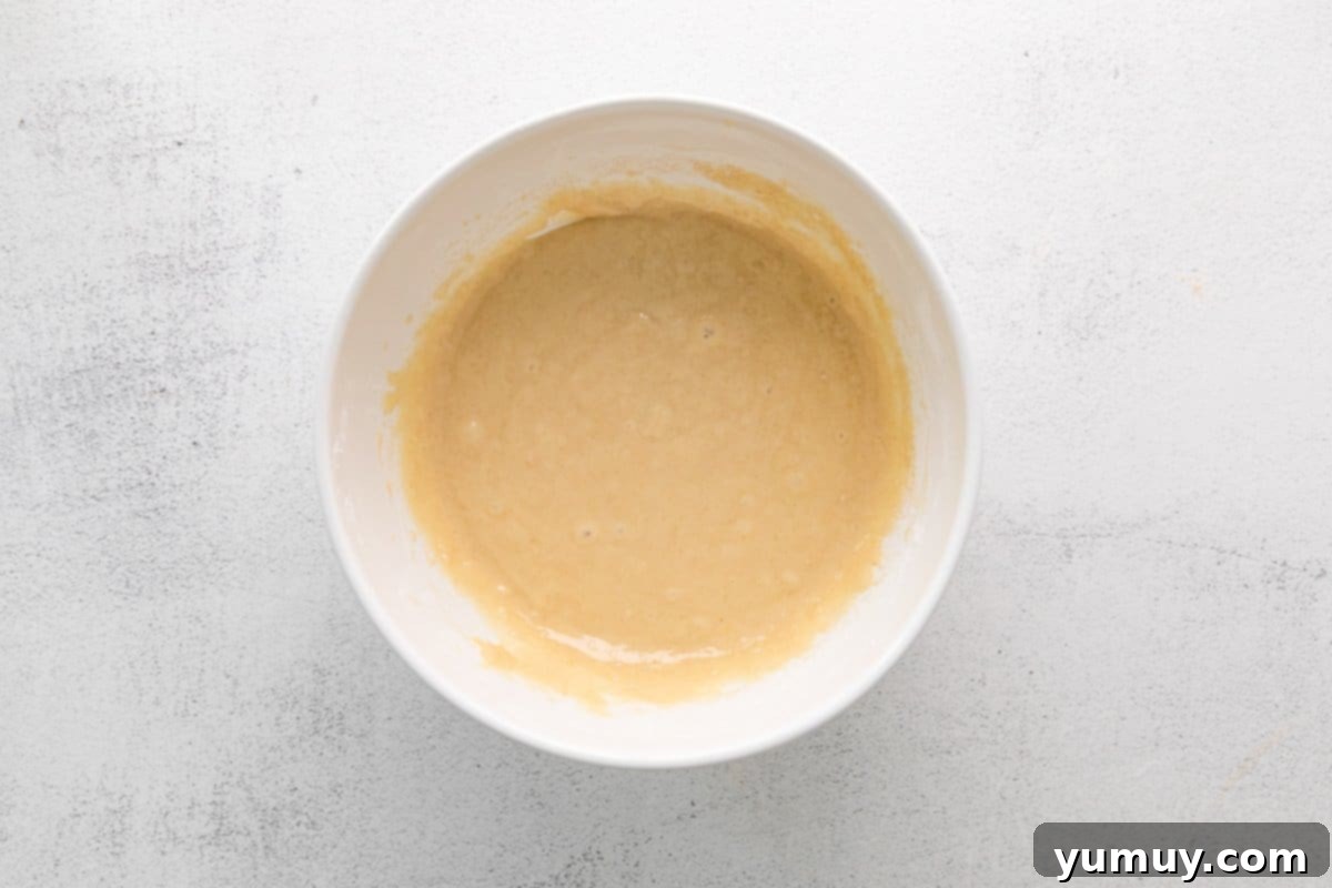 cinnamon swirl cupcake batter in a white bowl.