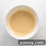 cinnamon swirl cupcake batter in a white bowl.