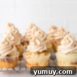 cinnamon swirl cupcakes on a wire rack.