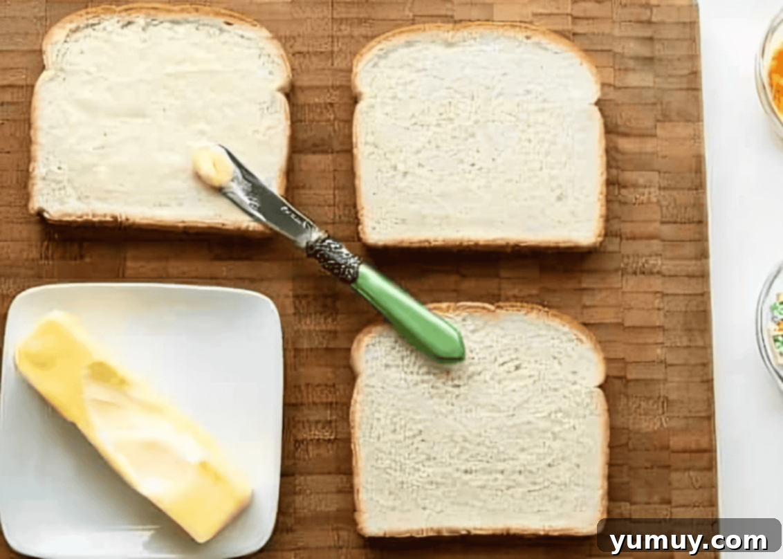 Fairy Bread Double Delight 12 spreading butter on soft white bread.