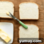Fairy Bread Double Delight 5 spreading butter on soft white bread.