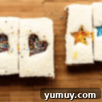 Fairy Bread Double Delight 10 nutella fairy bread sandwiches with cutouts.