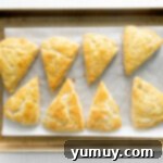 Fluffy Scones from Scratch 10 fresh scones lined up on a baking tray