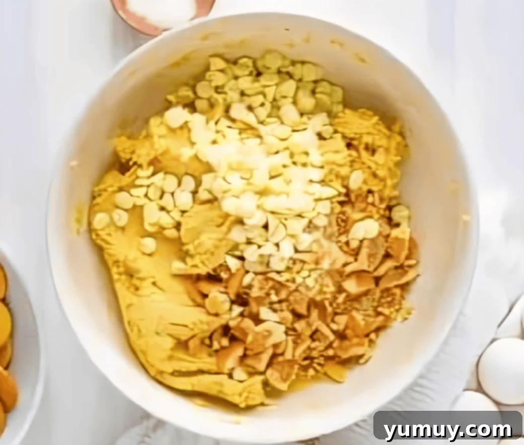 Southern Banana Pudding Cookies 15 Banana pudding cookie dough with white chocolate chips and larger crushed vanilla wafers folded in