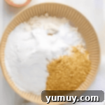 Southern Banana Pudding Cookies 6 Finely crushed vanilla wafers and flour being mixed in a bowl