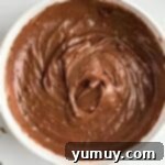 Chocolate cake batter in a bowl.
