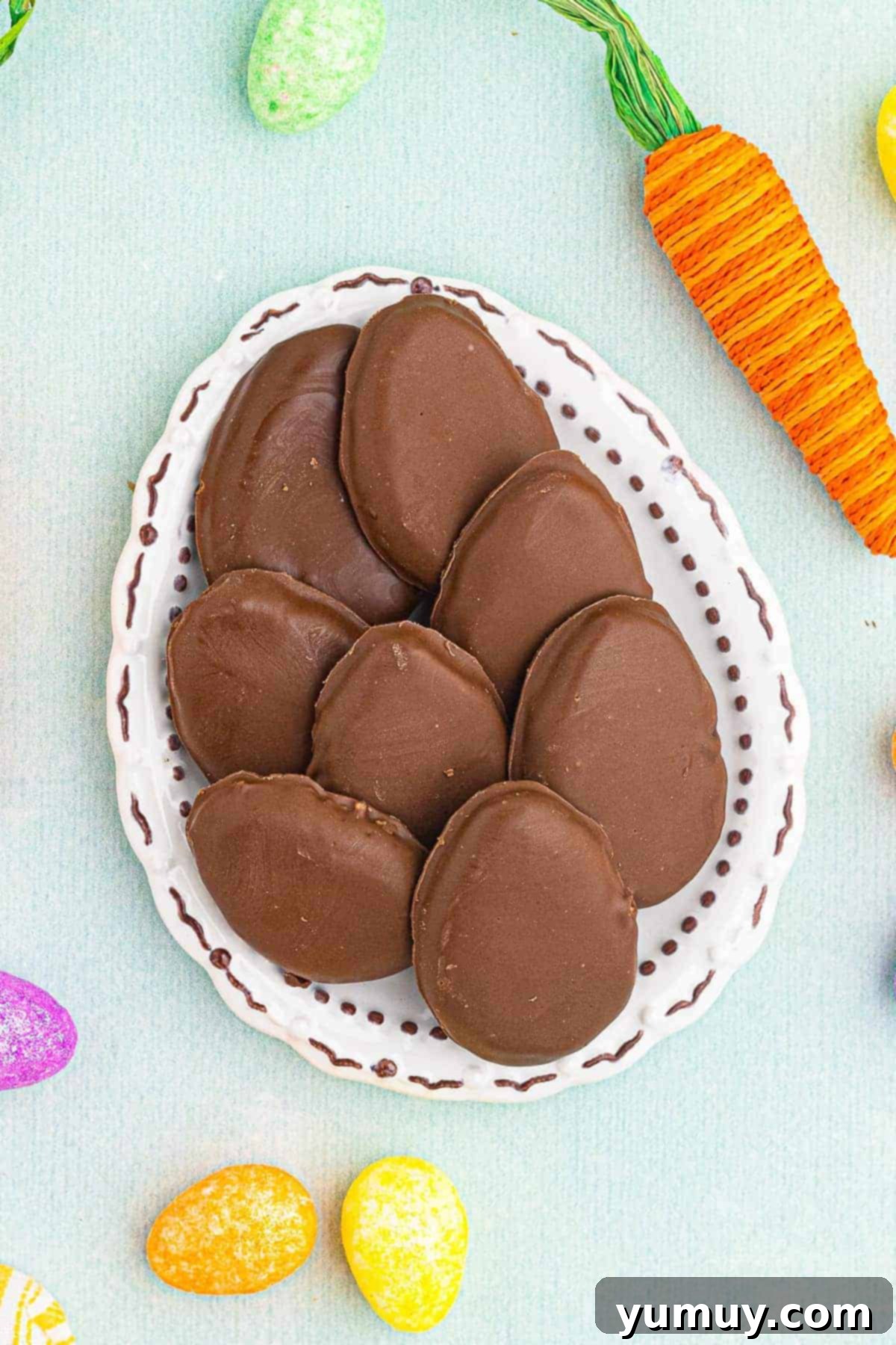 A platter stacked with delicious homemade Reese's style peanut butter eggs, ready for an Easter celebration.