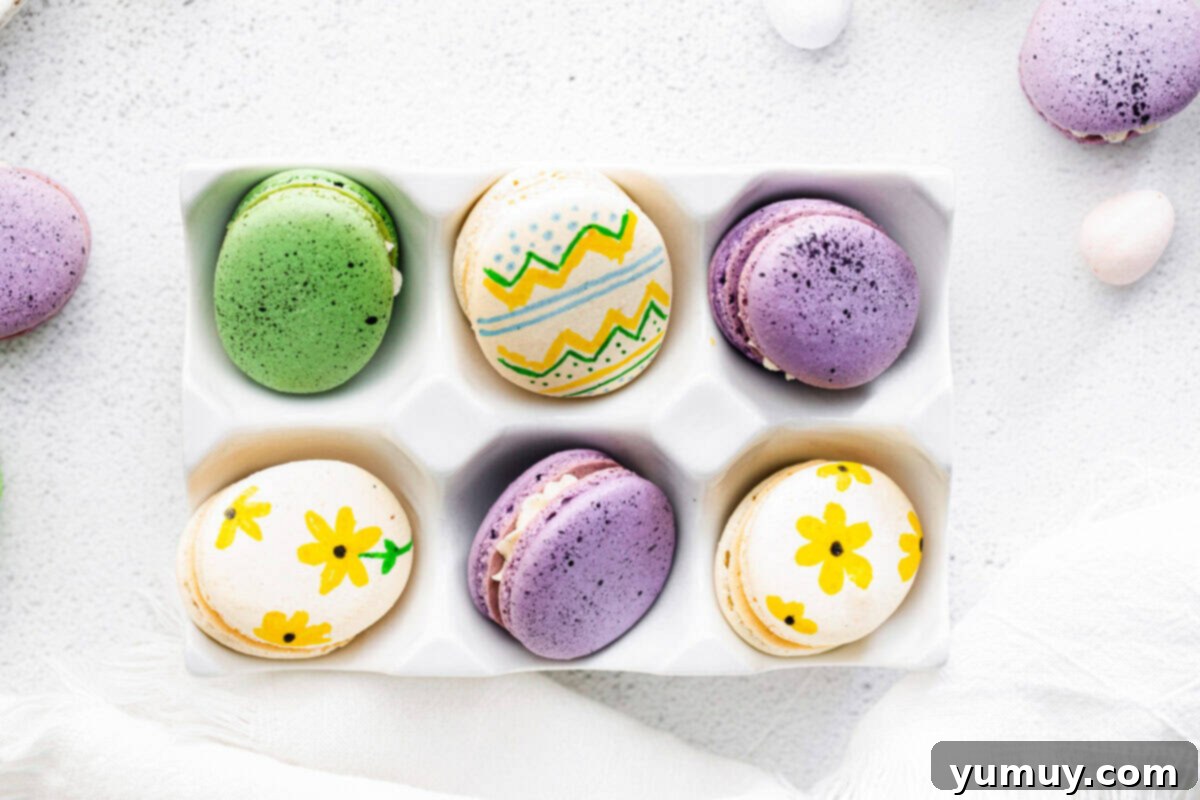 Springtime Macaron Delights 14 Overhead shot of beautifully decorated Easter egg macarons resting in an egg crate, showcasing various patterns and colors.