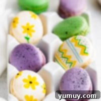 Springtime Macaron Delights 4 Side view of colorful Easter macarons in an egg crate, ready to be enjoyed.