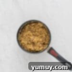 overhead view of german chocolate cake frosting in a saucepan.