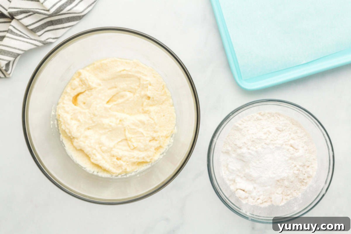 Whimsical Easter Egg Cookies 12 Overhead view of wet and dry ingredients for sugar cookies in separate glass bowls, ready for mixing.