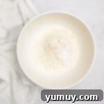 overhead view of dry ingredients for easter basket cookie cups in a white bowl.