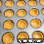 formed easter basket cookie cup dough in a mini muffin tin.