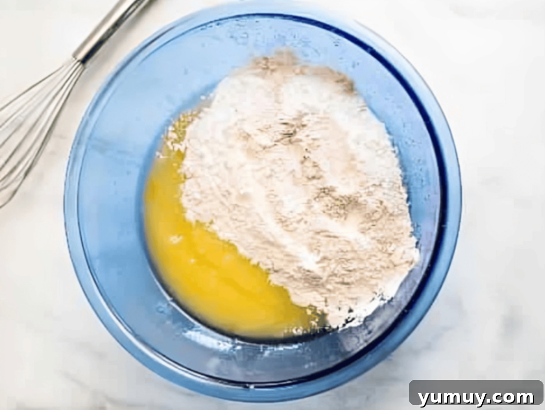 Spiced Carrot Cupcakes with Cream Cheese Frosting 8 cake mix and eggs in a blue bowl.