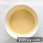 Luscious Blackberry Cupcakes 6 Unmixed cupcake batter with dry ingredients visible in a mixing bowl.