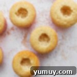 Baked cupcakes with the center dug out.