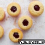 Cupcakes with the center removed and replaced with berry filling.