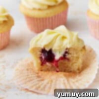 Berry-filled cupcakes recipe featured image, beautifully presented.