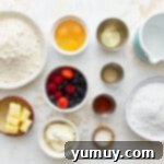 Ingredients for Berry-filled cupcakes arranged in dishes.