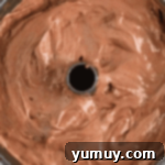 Light & Airy Chocolate Cloud Cake 11 chocolate angel food cake batter in a tube pan.