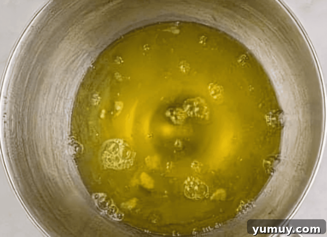 Light & Airy Chocolate Cloud Cake 14 egg whites in a stainless bowl.