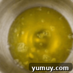 Light & Airy Chocolate Cloud Cake 5 egg whites in a stainless bowl.