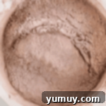 Light & Airy Chocolate Cloud Cake 8 sifted cocoa powder in a white bowl.