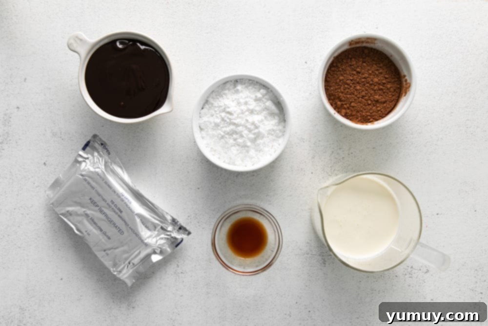 overhead view of ingredients for no bake chocolate cheesecake cups in individual bowls.