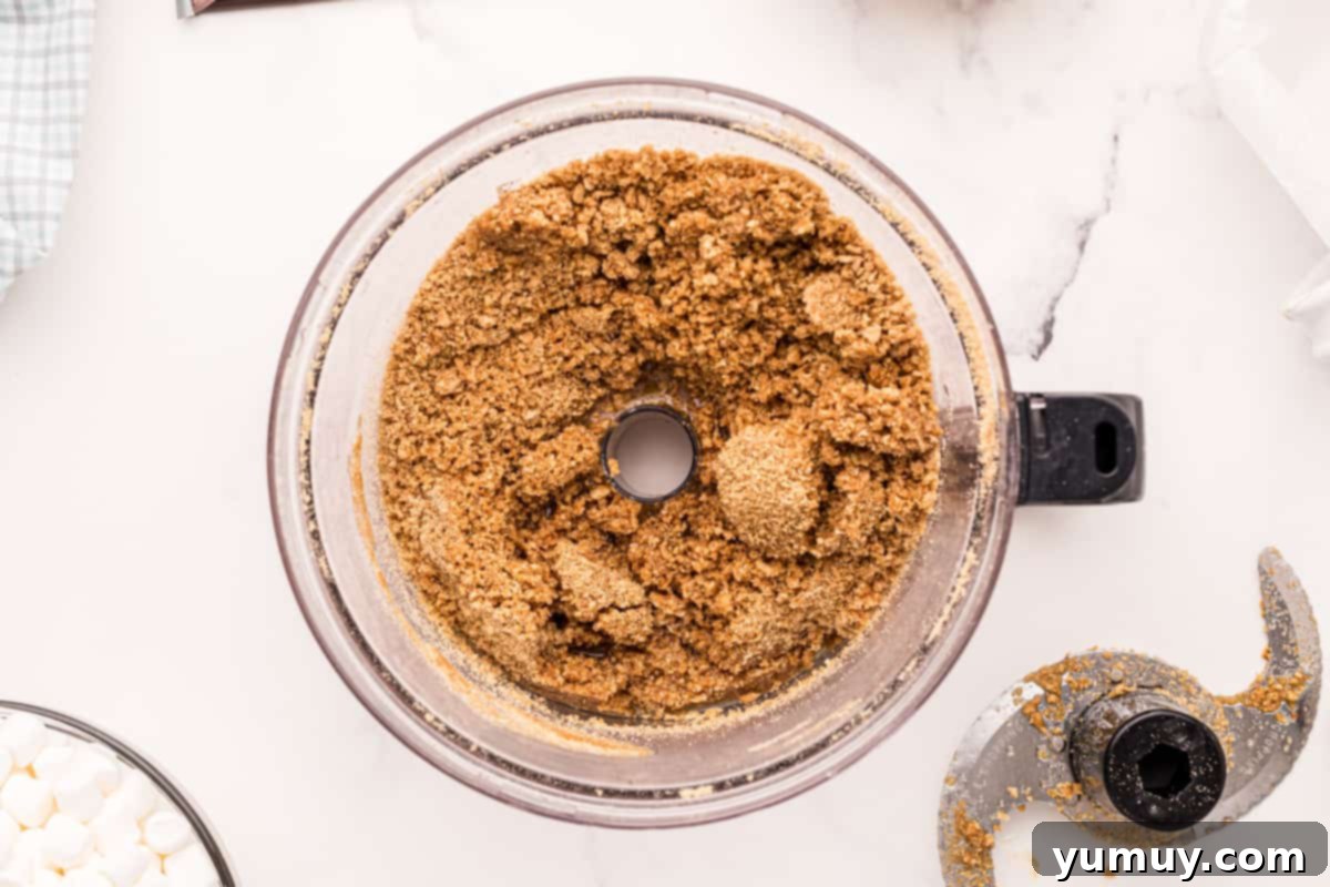 Smores Bars 16 buttery graham cracker crumbs in a food processor.