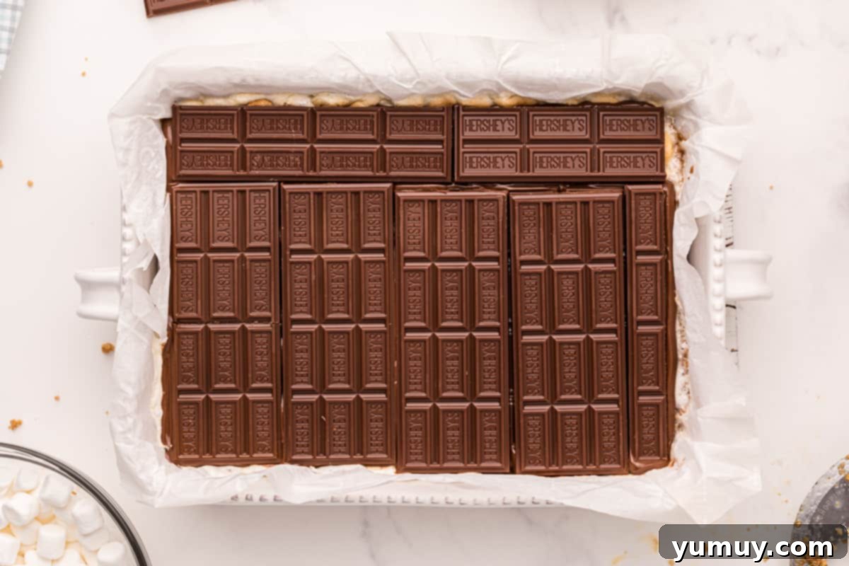Smores Bars 19 chocolate bars laid neatly in a baking pan.