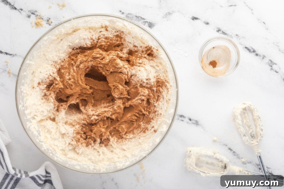 Caramelized Brown Sugar Buttercream 13 mixing cinnamon into buttercream