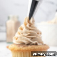 Caramelized Brown Sugar Buttercream 4 piping brown sugar buttercream onto a cupcake