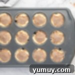 unbaked snickerdoodle cupcakes in a cupcake tin.