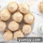 overhead view of frosted snickerdoodle cupcakes on a plate.