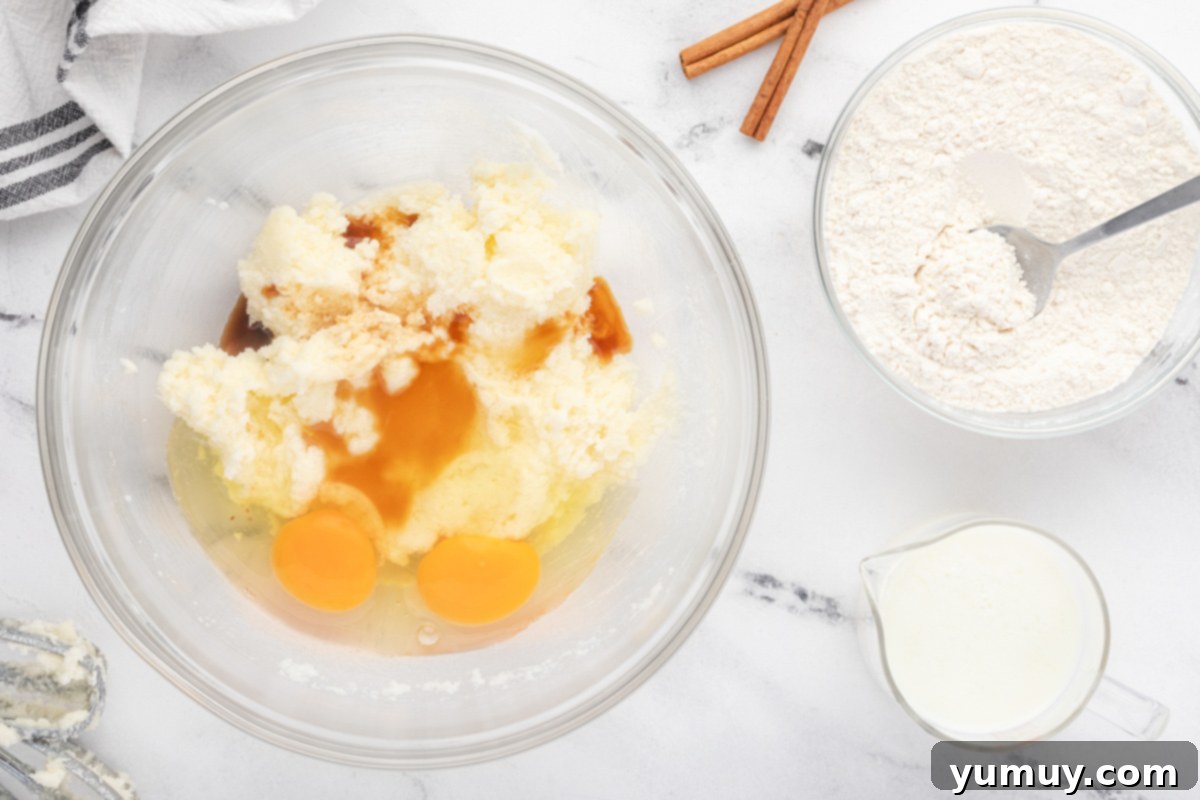 a bowl with eggs, flour, sugar and cinnamon.