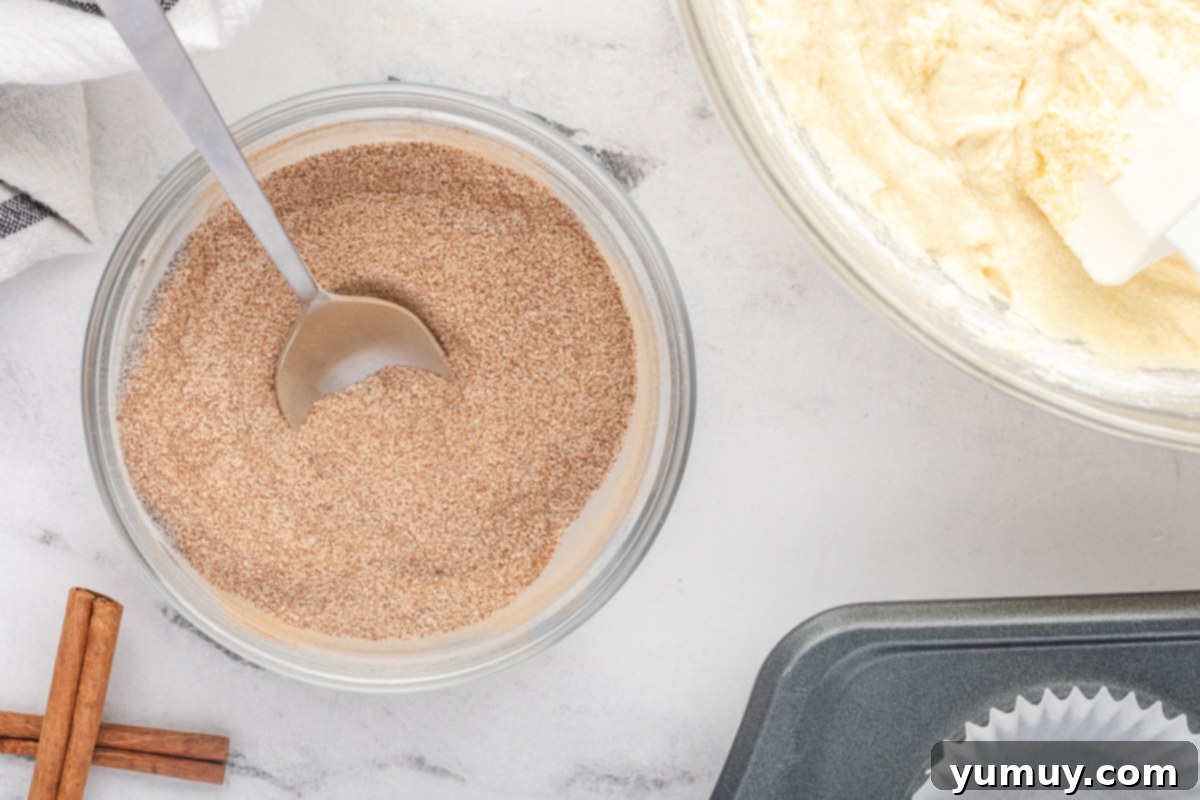 cinnamon and sugar in a bowl with a spoon.