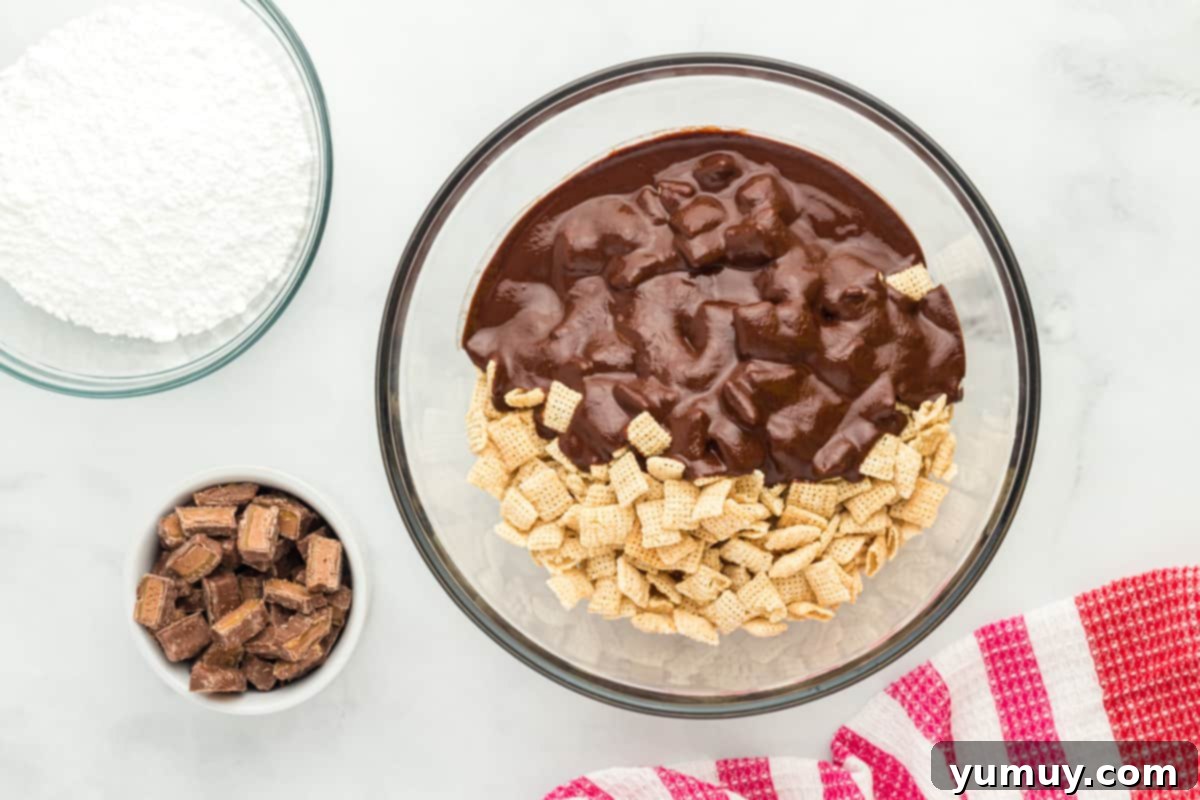 mixing chocolate mixture into a bowl of Chex