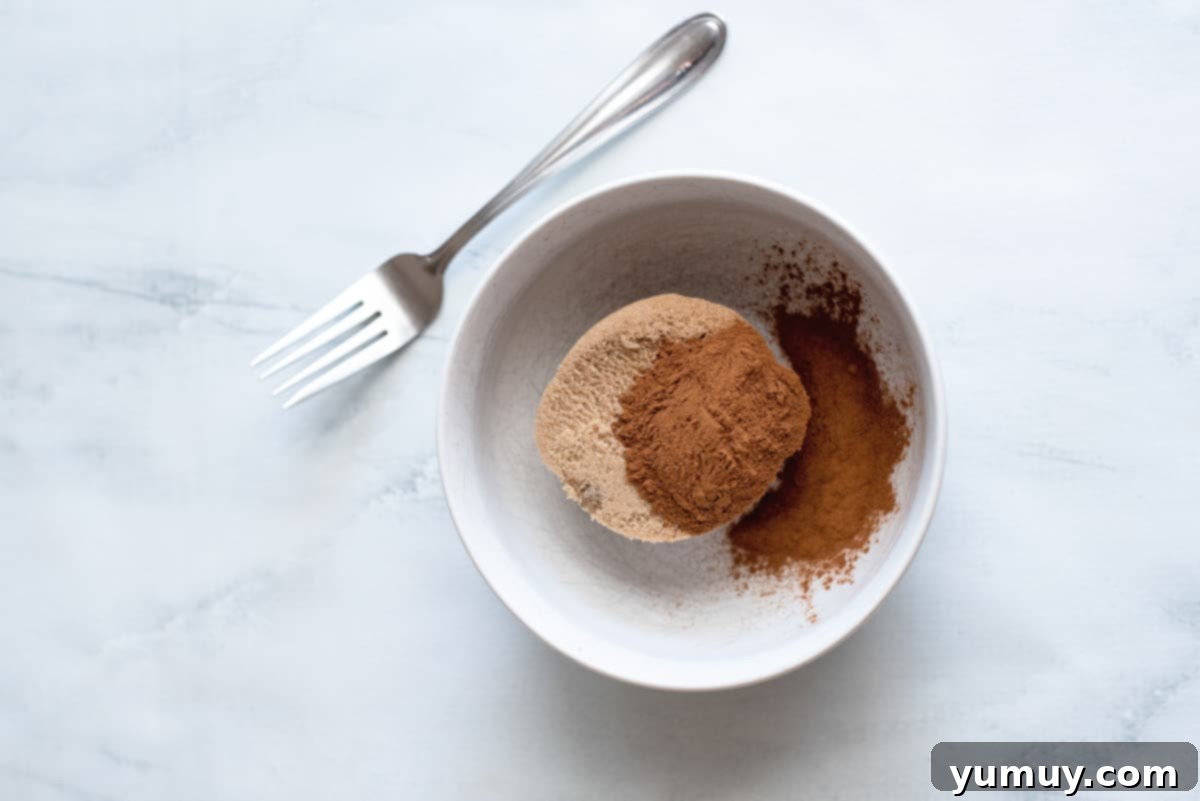 Snickerdoodle Swirl Bread 12 A small bowl holding brown sugar and cinnamon, perfectly combined and ready to use.