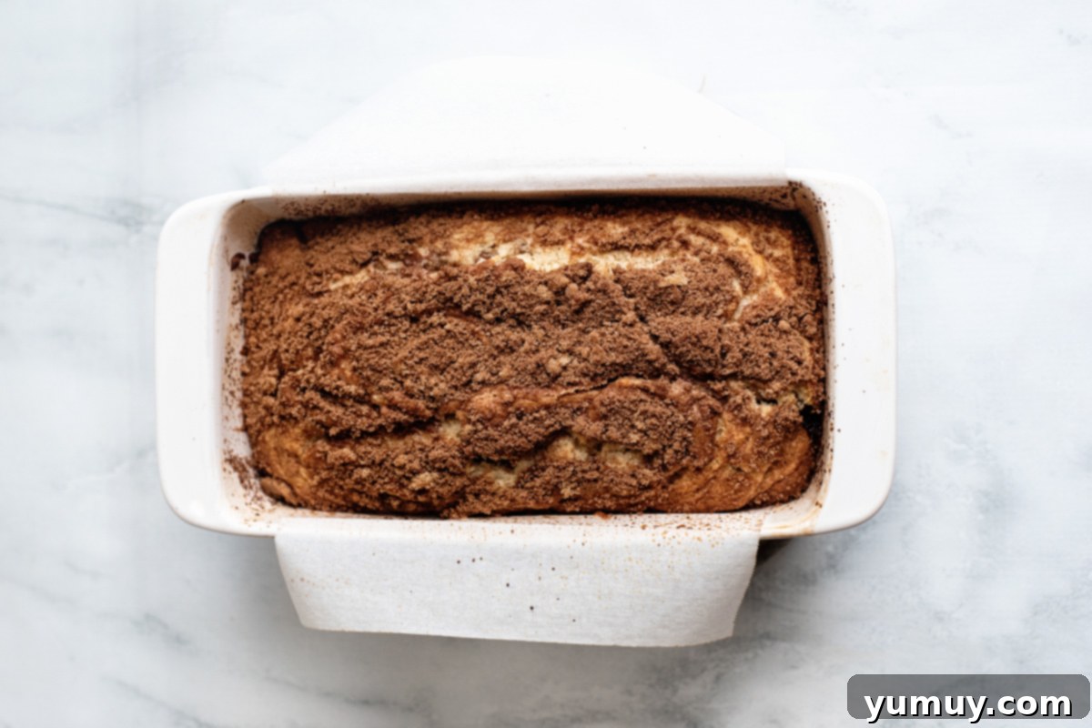 Snickerdoodle Swirl Bread 16 A freshly baked snickerdoodle bread, beautifully topped with cinnamon brown sugar, still warm in its baking dish.