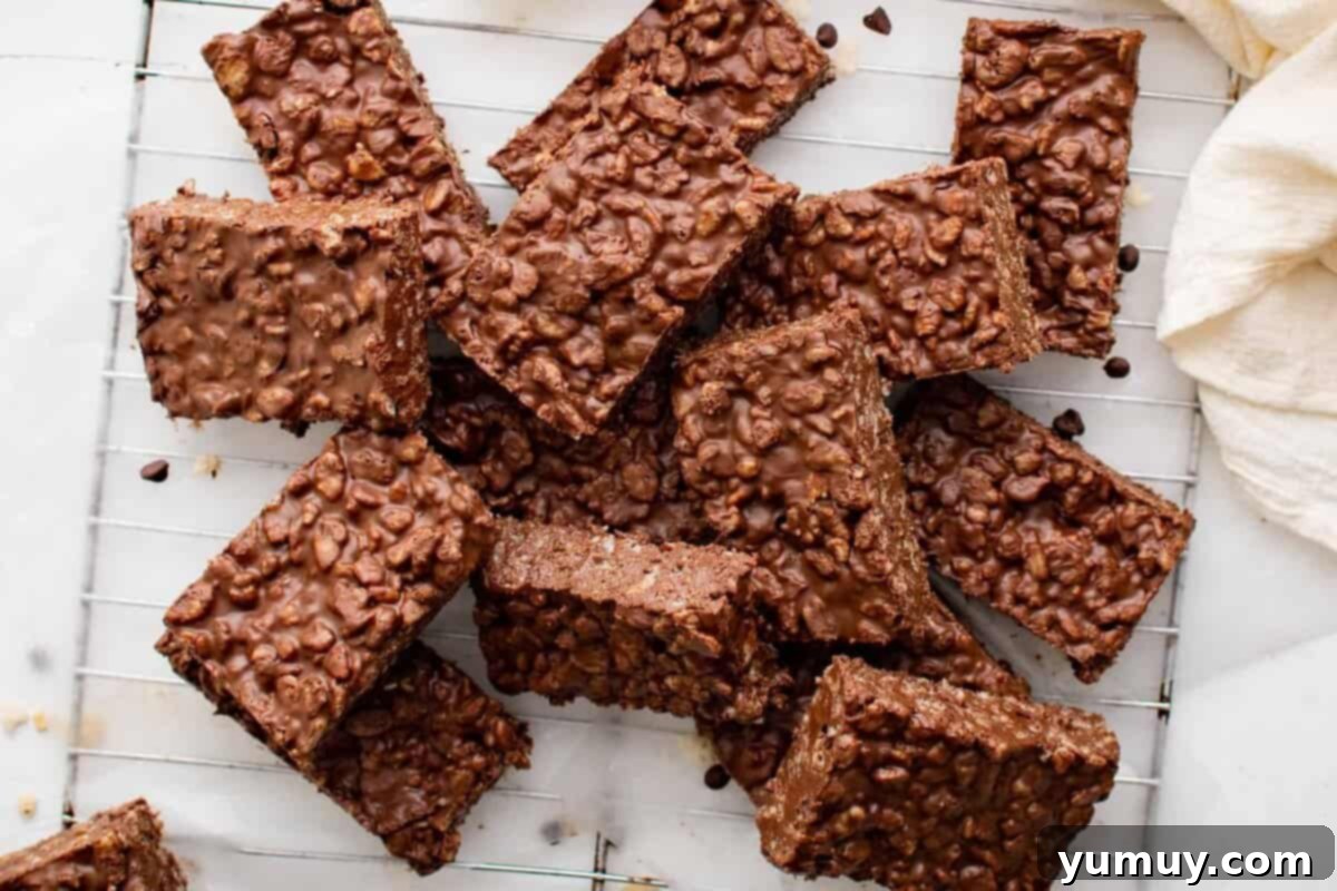 Irresistible Homemade Crunch Bars 3 A stack of homemade chocolate crunch bars resting on a wire rack, cooling.