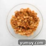 a bowl of pretzels on a white background.