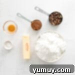 overhead view of ingredients for caramel pecan buttercream in individual bowls.