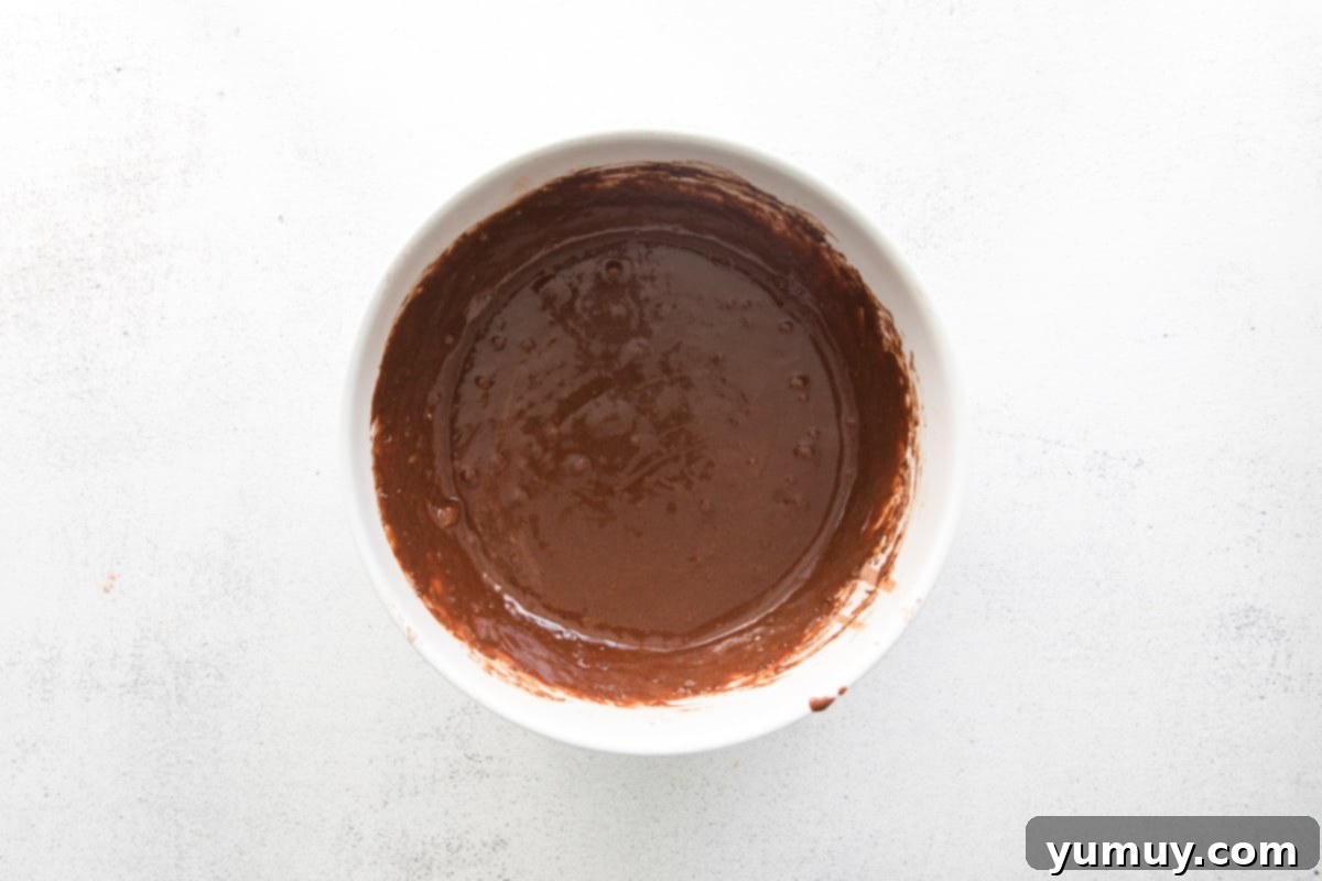 chocolate cupcake batter in a white bowl.
